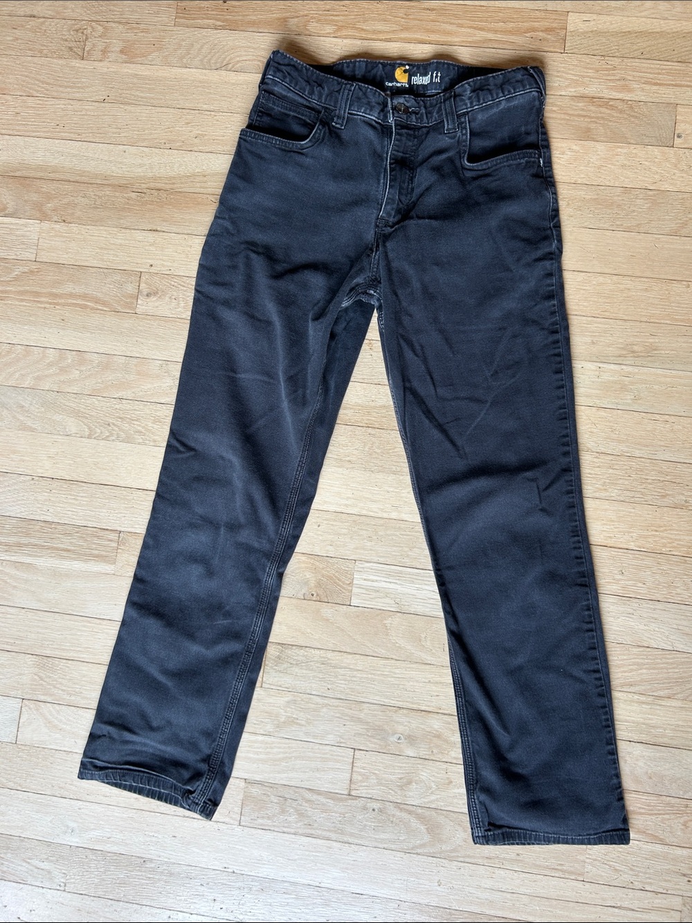 Carhartt Relaxed Fit Jeans in Black with Yellow Logo